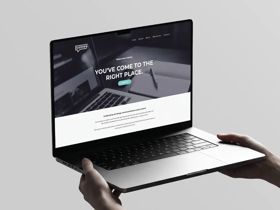 Laptop held in two hands showing the Convey Communications website hero with the line You’ve come to the right place.